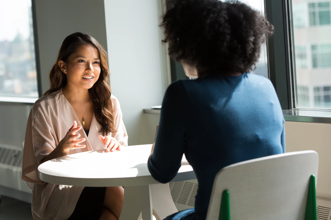 Two women in conversation during an interview